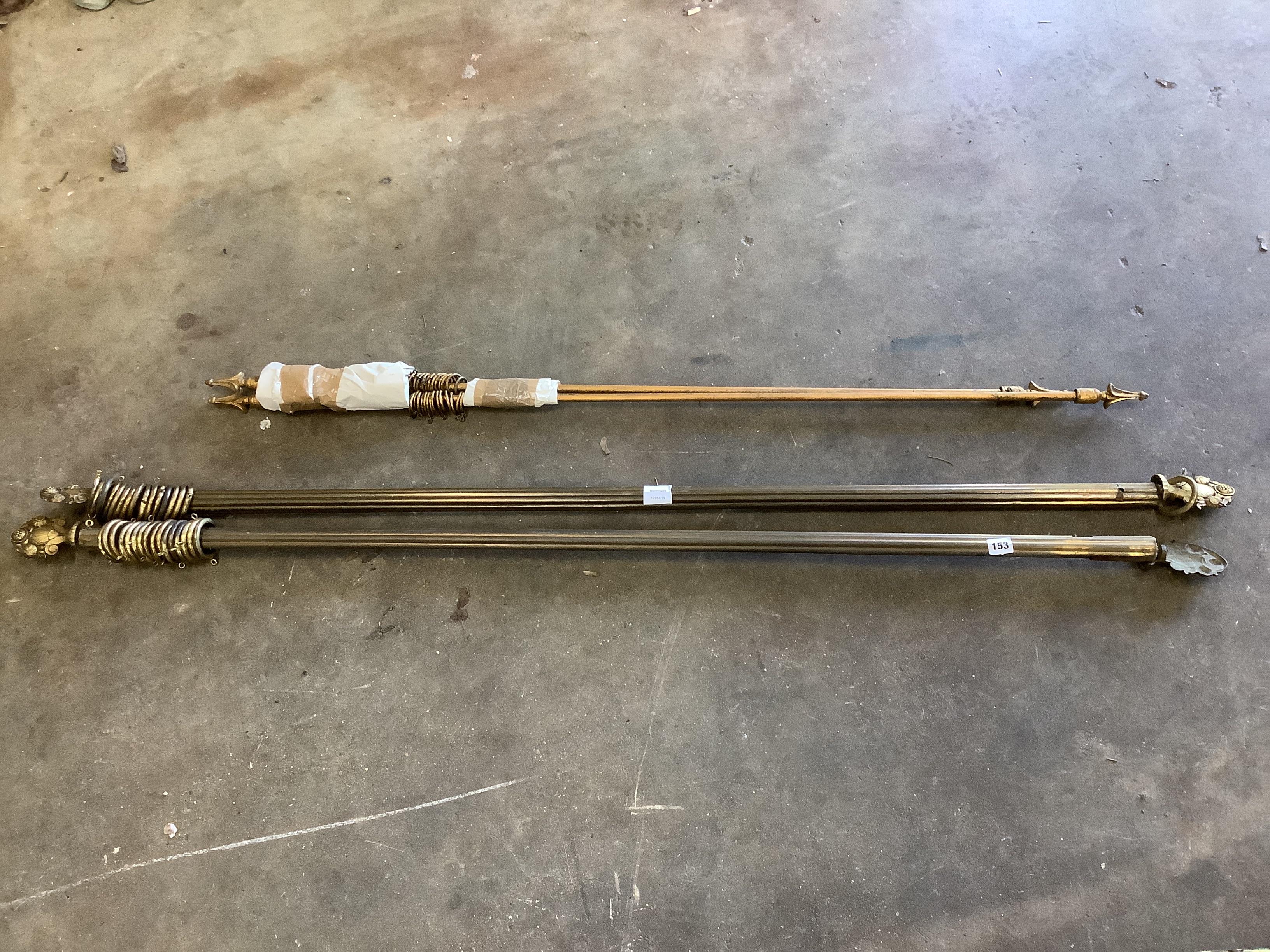 Two pairs of gilt metal curtain poles together with assorted brackets, rings and fixings, larger length 170cm